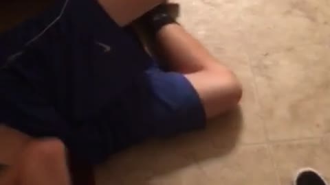 Guy sits on fridge door face plant