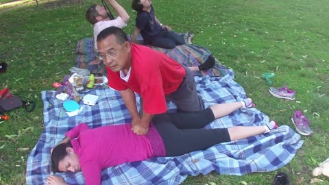 Luodong Massages Cute Woman In Pink On The Picnic Blanket