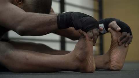 Man Stretching His Arms and Legs