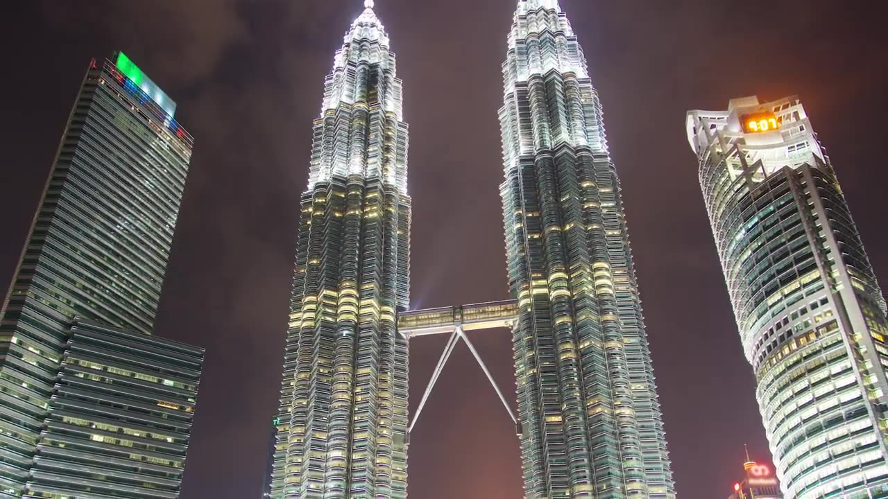 Large buildings lit up at night