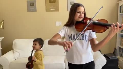 Booth brother and sister sing a song