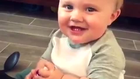 cute baby Laughs with dady