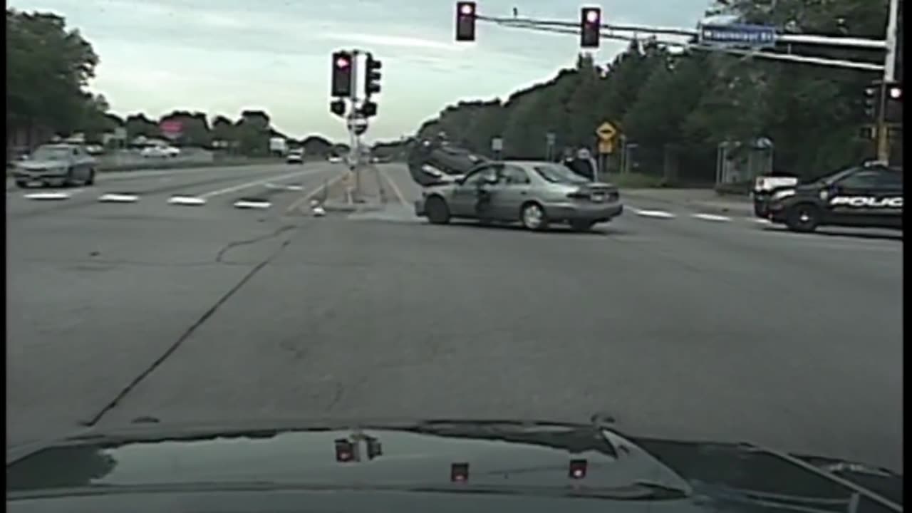 Police car gets blasted at red light (caught on camera)