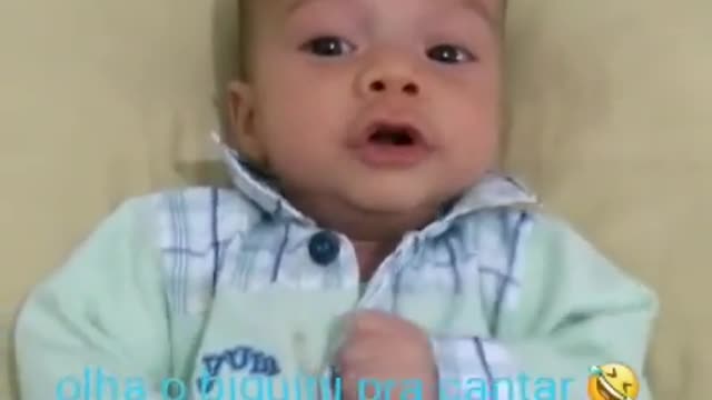 baby singing with mom