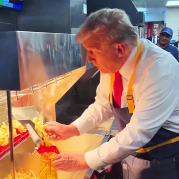 TRUMP WEARING THE NAZI COLOURS SERVING POISON UNDER THE MASONIC ARCHES OF ADRENOCHROME