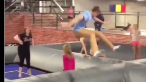 Man in light blue jumps and drops little girl