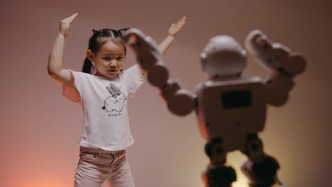 Girl dancing with robot