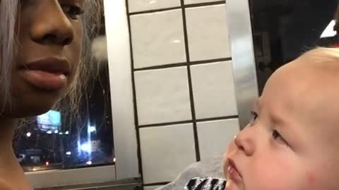 Baby Stares At Woman Then Smirks