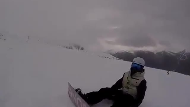 Grey snowboarder hits filmer skier