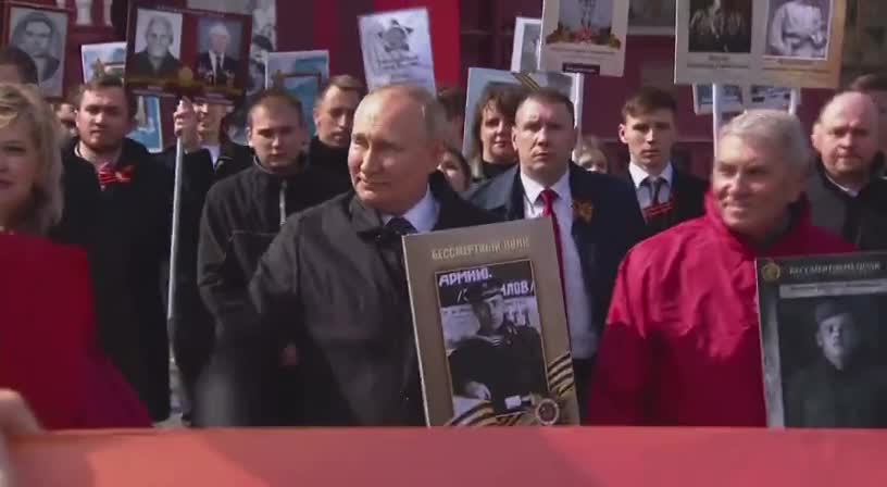 President Putin with a portrait of his father at the Immortal Regiment march