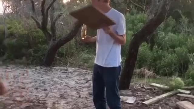 Nsfw guy throws rock and hits beer out of friends hand