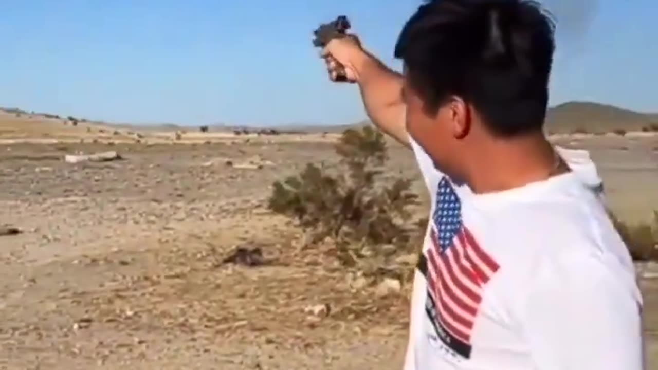 An Asian man, firing his weapon, declares a dark promise to conquer America (California)