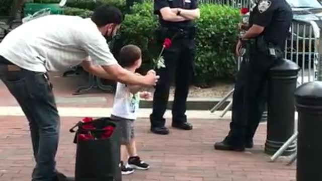 Little boy showing love to the NYPD.