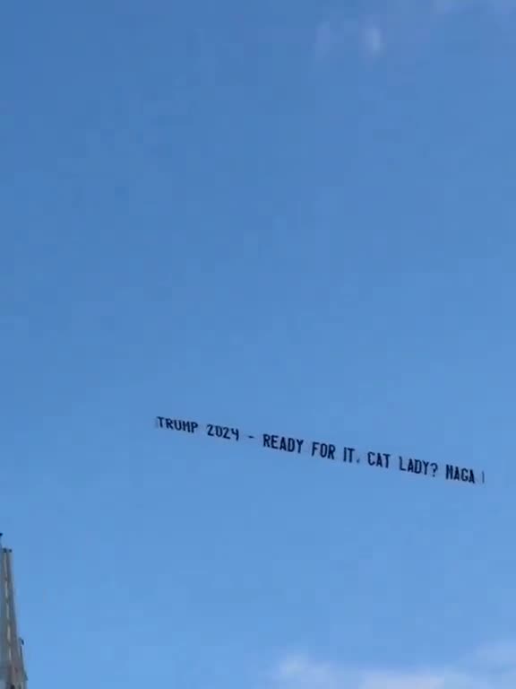 Banner flies over Taylor Swift concert in Miami.
