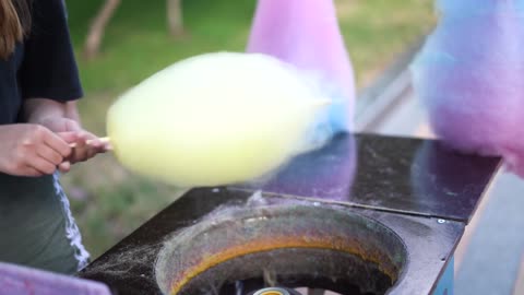 Woman making cotton candy