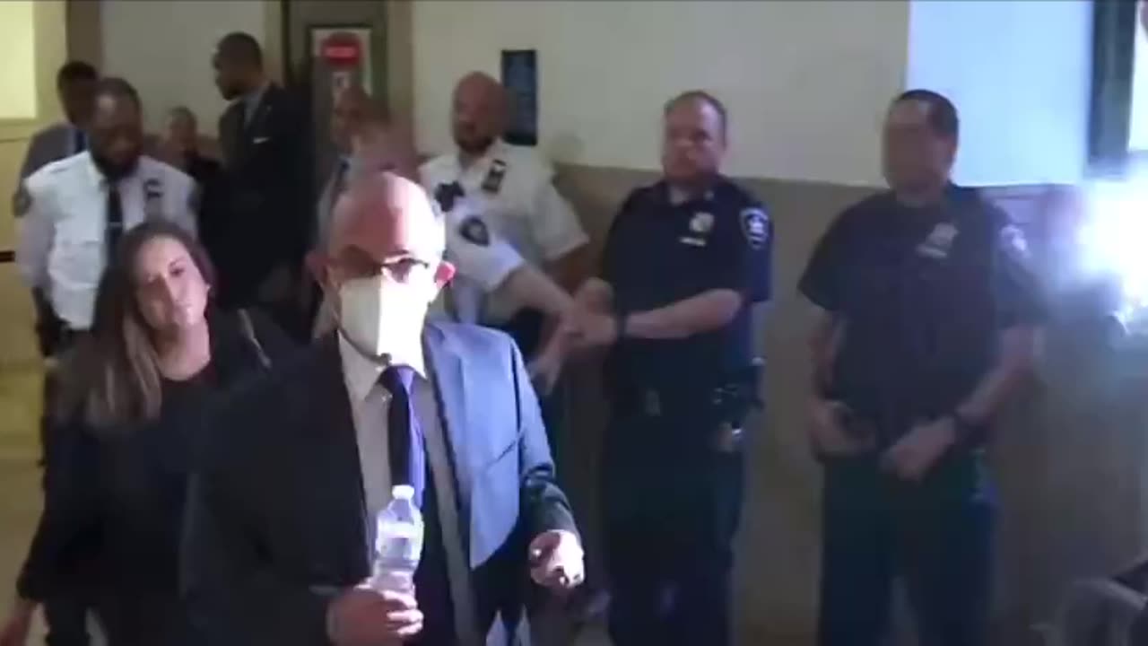 Who is this masked man coming out of the courtroom