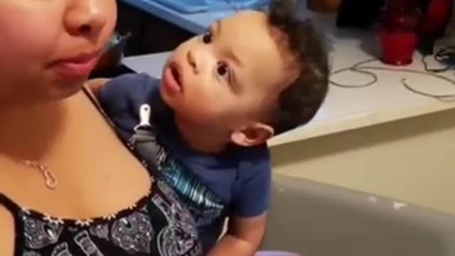 Mom eats baby food while he watches!