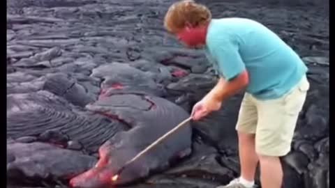 White Man Poked Lava With Wooden Stick