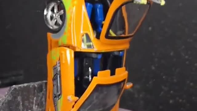 Put the car model on the grinder.