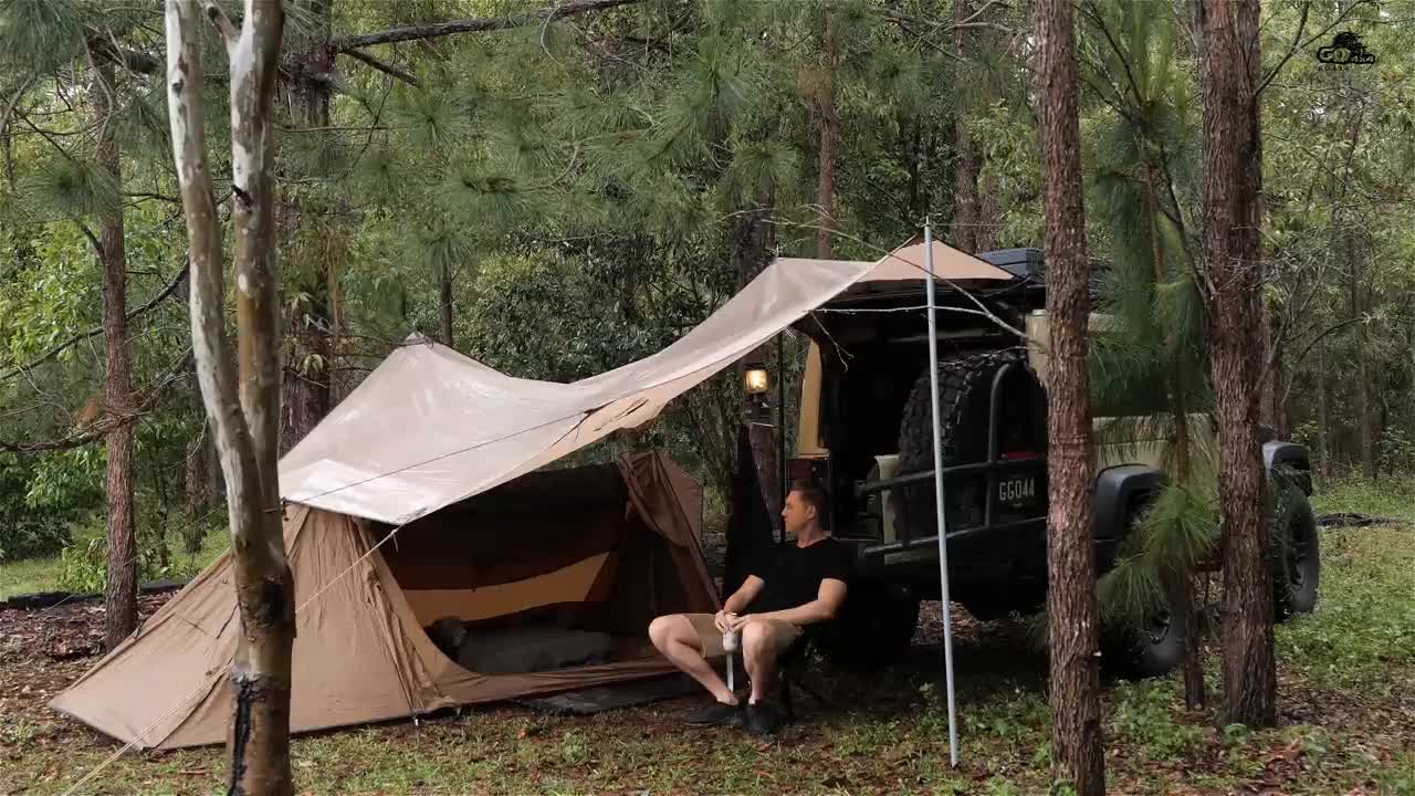 It's a nice day in the car with the dog camping in the tent