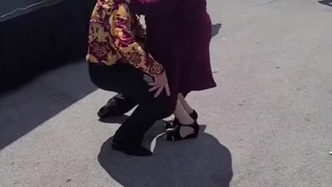 Elderly Couple Dances To Rhythm Of Music At a Party