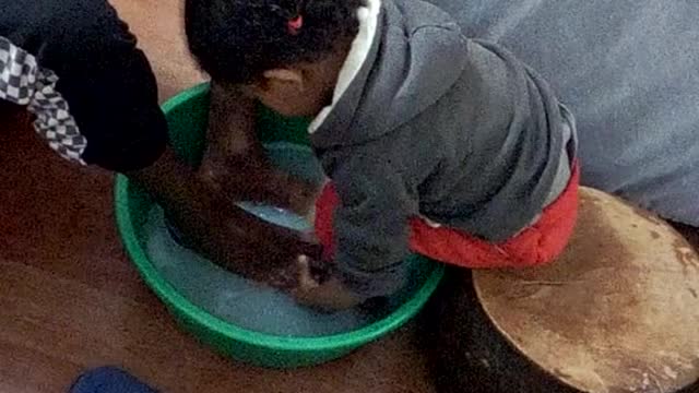 My daughter washing her father's feet