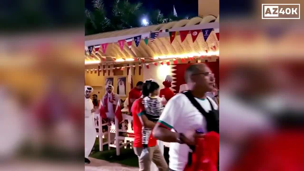 Qatar Families Giving Snacks To Football Fans Attending Matches at the World Cup