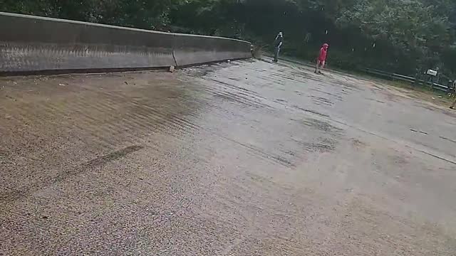 Flash Flooding Forces Debris Under Bridge