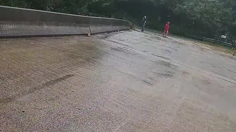 Flash Flooding Forces Debris Under Bridge