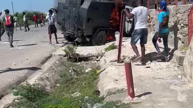 Port au Prince Gangs destroy police armored car