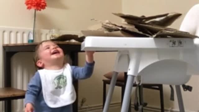 Baby Delighted by Recycling