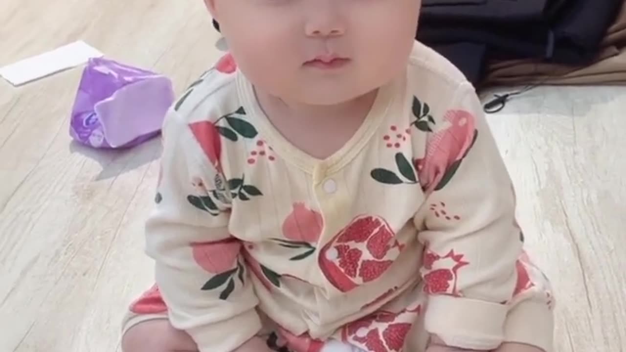 Cute baby playing with dancing cactus