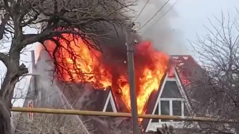 Burning house in Mariupol