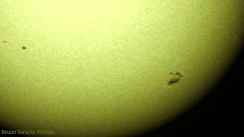 Two Very Large Sun Spots Merged Together after Crossing Magnetic Field Lines