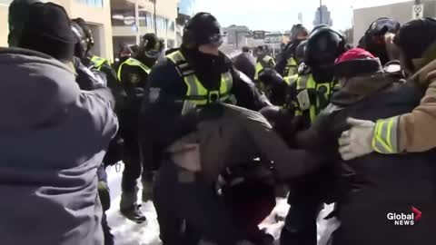 Police in Ottawa brutalize a protester, kneeing him until he hits the ground