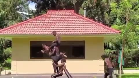 Group Of Men Perform Impressive Acrobatic Balancing Tricks