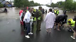 People flee as floods submerge Australian towns