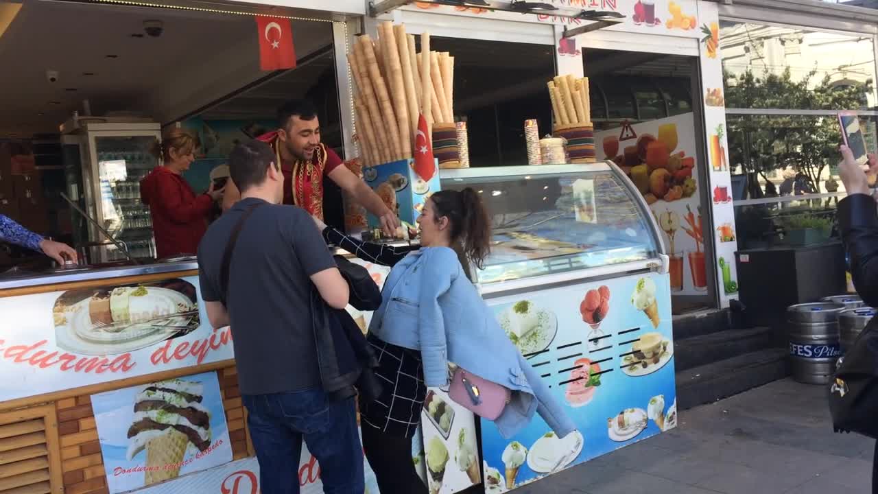 Turkey Istanbul ice cream seller having fun with customers