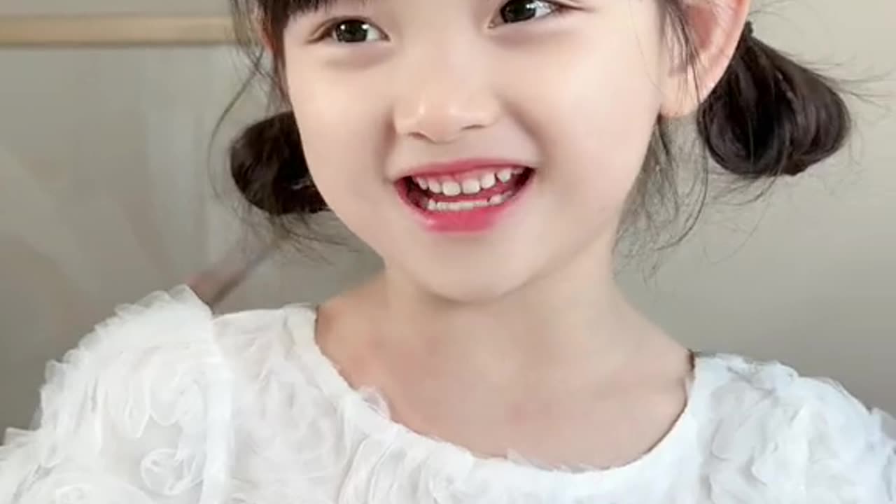 cute smiling baby girl in white dress