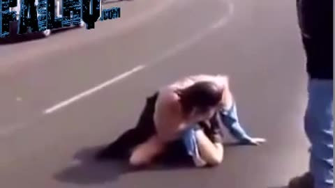 Biker chick beats up security guard