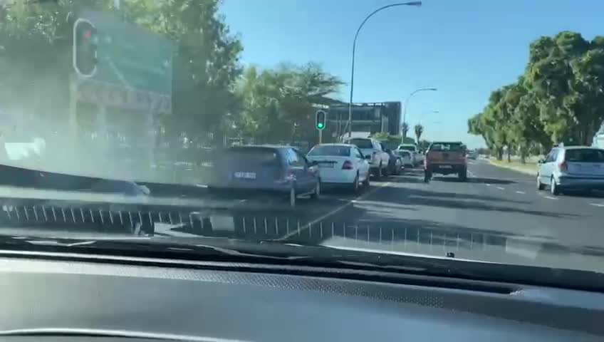 Cars standing in the queue to test