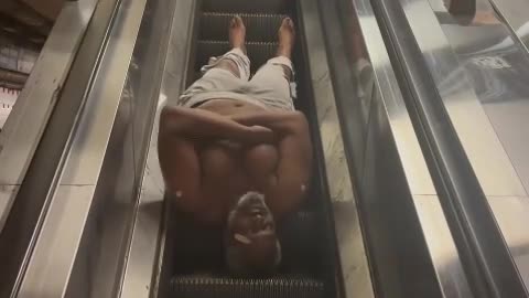 Bum's Wild Ride Down the Escalator! 😂 #StreetComedy #NYC #FunnyShorts #LOL