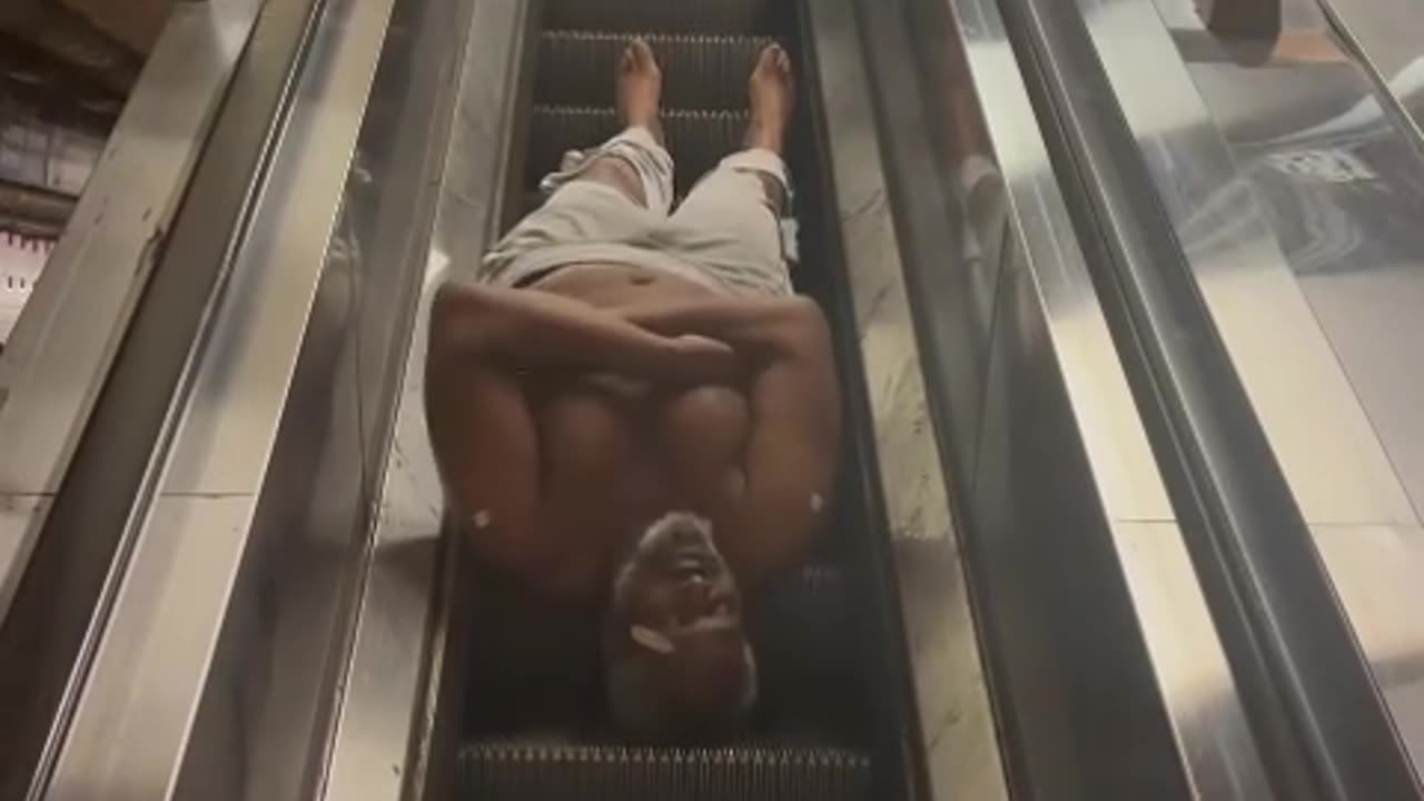 Bum's Wild Ride Down the Escalator! 😂 #StreetComedy #NYC #FunnyShorts #LOL