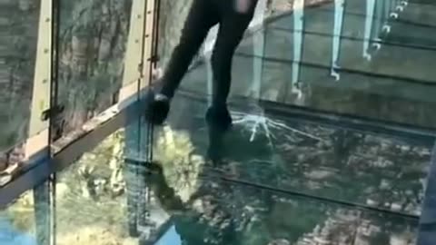 This glass bridge in China has a TV screen installed in the middle, which plays fake cracks & sound