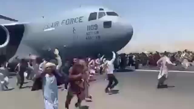 Desperate Afghans trying to get into American Aircraft which is about to take-off