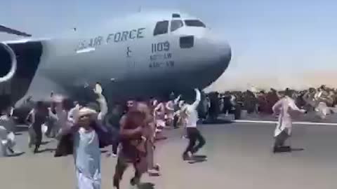 Desperate Afghans trying to get into American Aircraft which is about to take-off