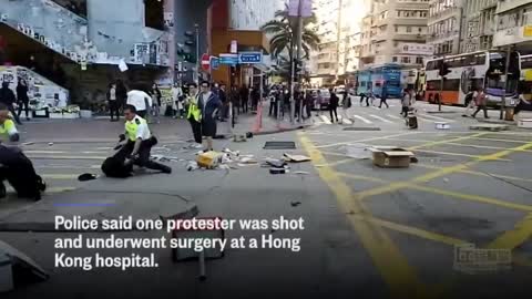 Hong Kong Police Officer Shoots Protester At Close Range | NBC News