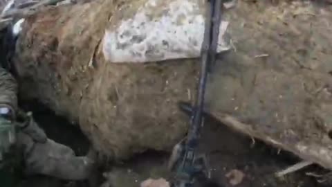 The APU fighter fires from the trench at arm's length, afraid to aim normally