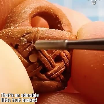 Artist turns fruit pit into a work of art!.hd