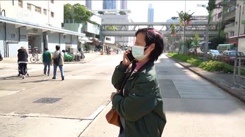 What happens when Hong Kong opens its borders to the mainland, where cases are surging?